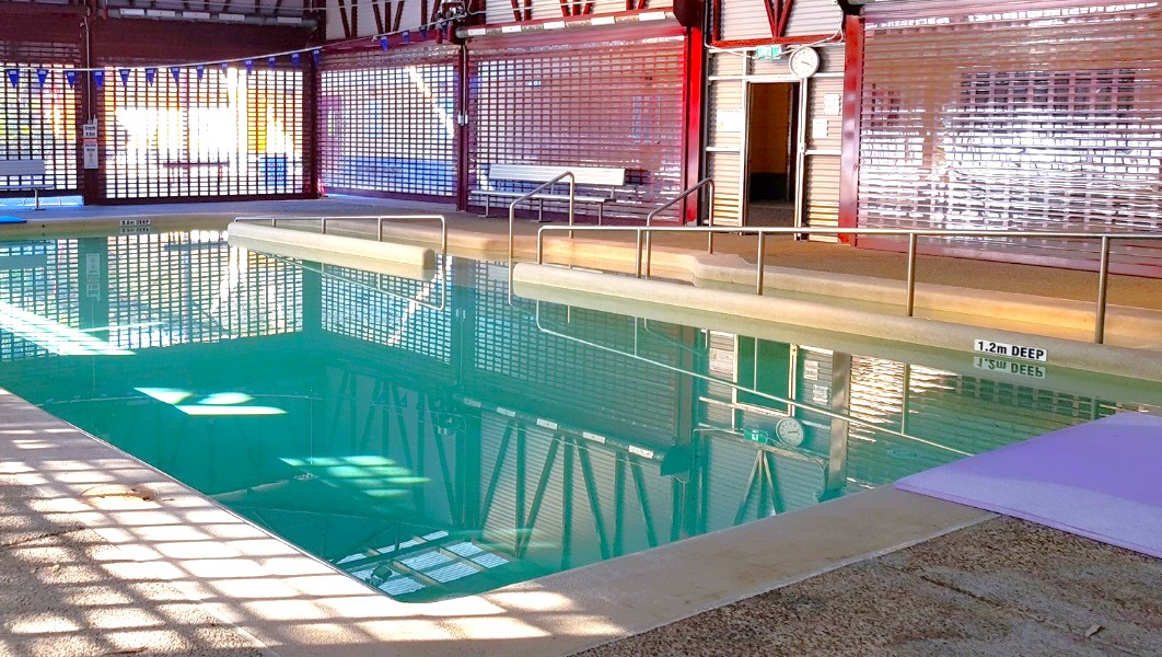 The indoor heated pool at Bribie Island Aquatic and Leisure Centre. There is a small sign indicating that the pool is 1.2m deep. For safety, there are railings placed at the right corner of the pool, right where the main entryway is located. On top of the front door, there's a gallery clock, making it convenient to keep track of time while enjoying the pool. The indoor heated pool at Bribie Island Aquatic and Leisure Centre. There is a small sign indicating that the pool is 1.2m deep. For safety, there are railings placed at the right corner of the pool, right where the main entryway is located. On top of the front door, there's a gallery clock, making it convenient to keep track of time while enjoying the pool.
