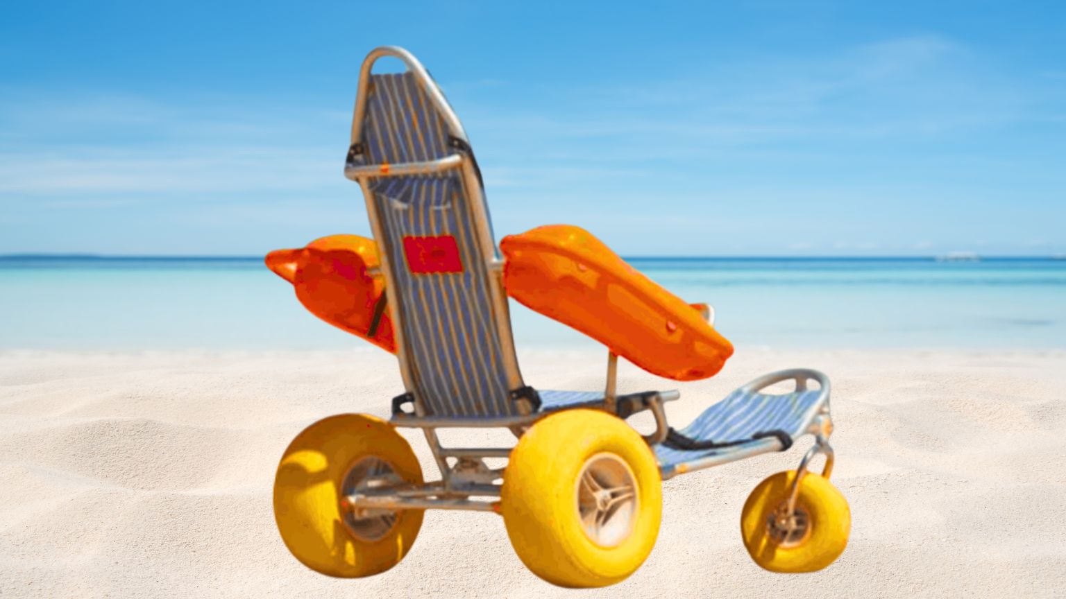 A beach scene with a unique cart-like wheelchair on white sand, featuring large yellow wheels, blue striped seat, and an orange lifebuoy or float attached. The ocean and blue sky stretch into the background.