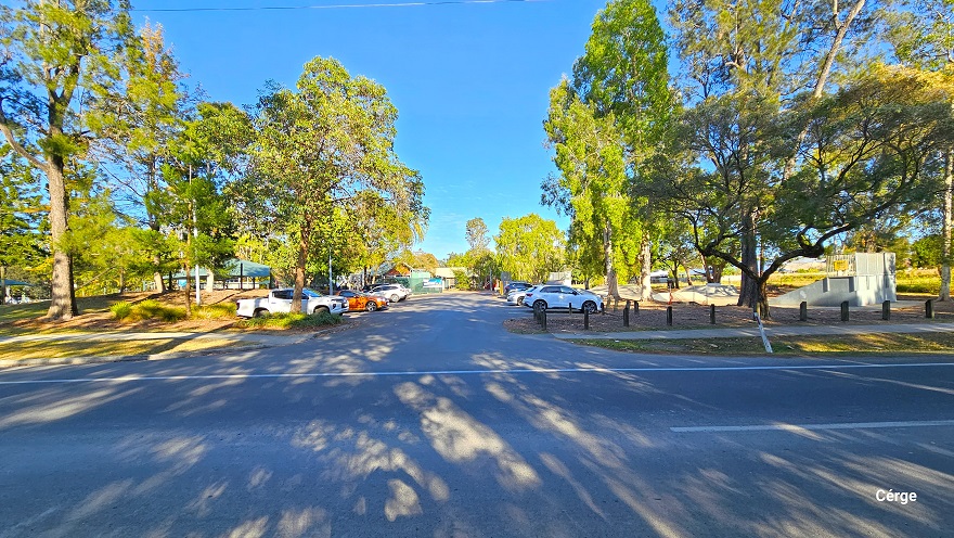 Arrival at Dayboro Pool & Gym is at a local park in Dayboro, on the corner of two main roads. The park has tall native Gum and Paperbark trees. On the sides are white diagonal road markings to regulate traffic and for emergency purposes on Mt Mee Road. This road is marked by a Mt Mee sign and a blue Showground sign with arrows pointing to the right. Following the concrete pathway to the right is the carpark. Arrival at Dayboro Pool & Gym is at a local park in Dayboro, on the corner of two main roads. The park has tall native Gum and Paperbark trees. On the sides are white diagonal road markings to regulate traffic and for emergency purposes on Mt Mee Road. This road is marked by a Mt Mee sign and a blue Showground sign with arrows pointing to the right. Following the concrete pathway to the right is the carpark.