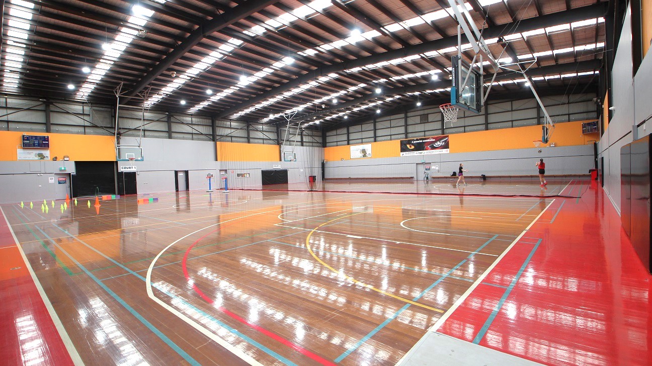 Gymnasium is divided into two courts. The first court is labeled as “Court 1” while the 2nd court is labeled “Court 2”. Separating the two courts is a net. Gymnasium is divided into two courts. The first court is labeled as “Court 1” while the 2nd court is labeled “Court 2”. Separating the two courts is a net.