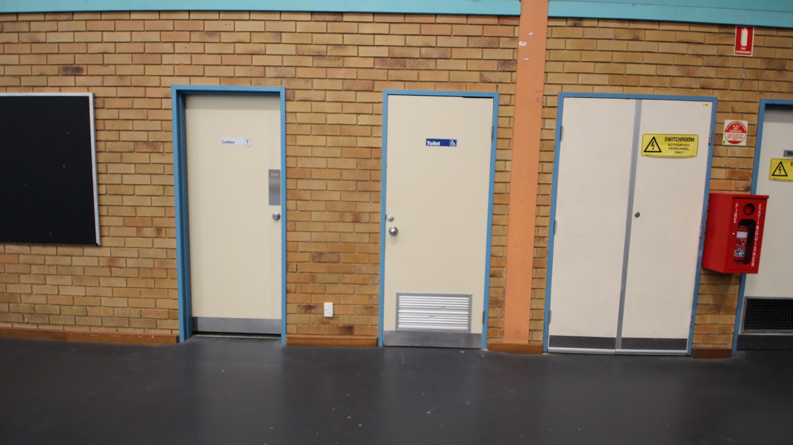Accessible bathroom for persons with mobility disabilities is available inside the Stadium and is marked by a blue label affixed to the dirty-white bathroom doors with sky blue edges. On the left is the female bathroom door while on the right is a switch room for authorized personnel. Accessible bathroom for persons with mobility disabilities is available inside the Stadium and is marked by a blue label affixed to the dirty-white bathroom doors with sky blue edges. On the left is the female bathroom door while on the right is a switch room for authorized personnel.