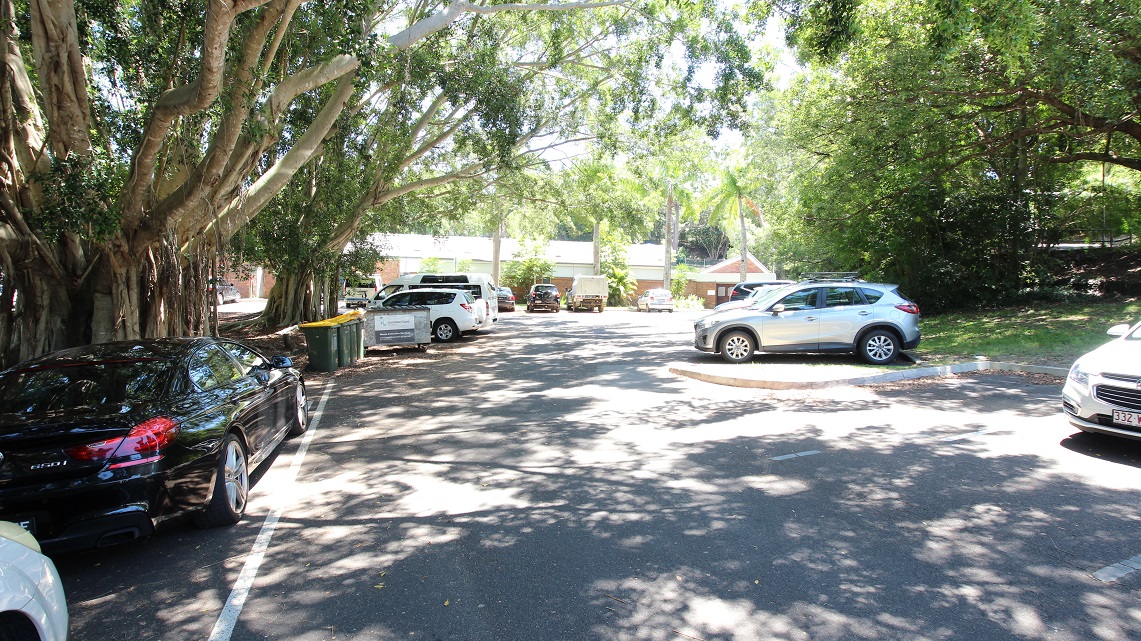 Set back further from the preceding images to showcase the winding car park around the Nambour Aquatic Centre. It is also shown the significant shading across the carpark due to the dense foliage of the surrounding green trees.