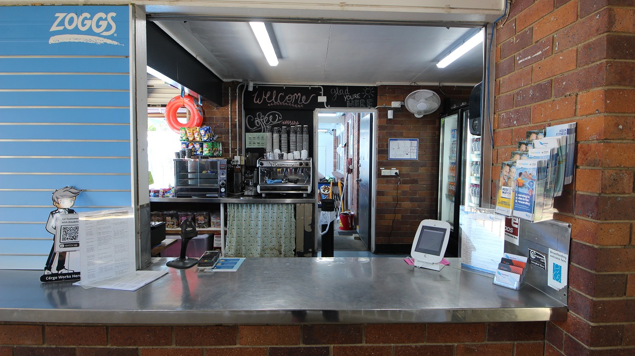 The reception counter at the Nambour Aquatic Centre is approximately 1200mm high and a stainless steel finish.  Within the reception area is a coffee machine and basic menu food items.