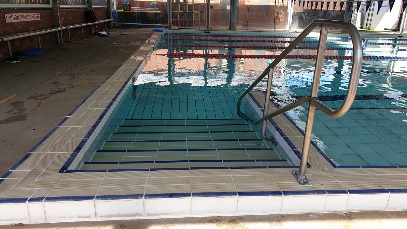 Accessible entry to the 25m pool includes  stainless steel handrail over approximately 6 steps into the pool.