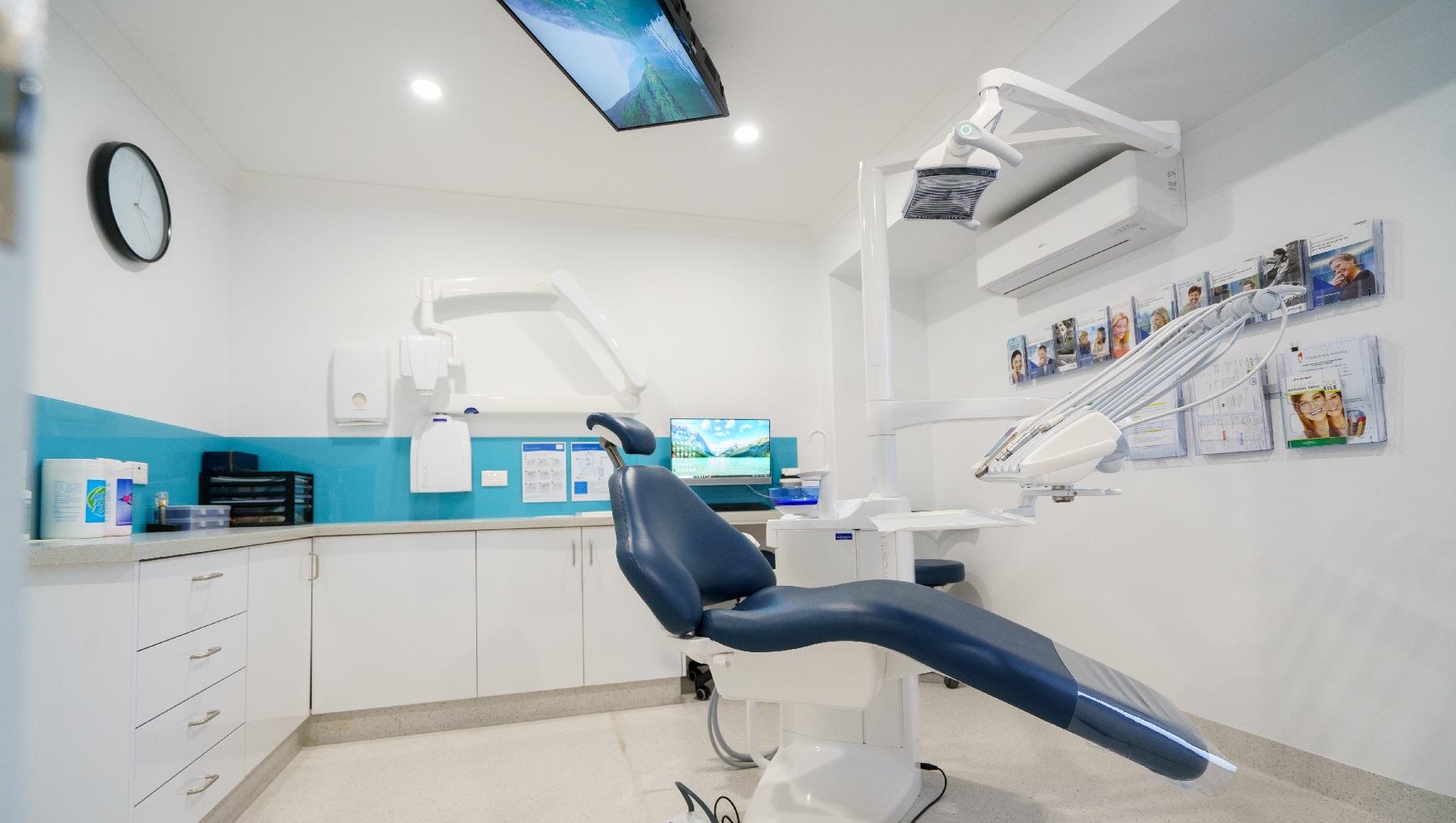 One of the rooms in the clinic that appears to be neat and well-organized. It is a room without a door and instead a wide opening that leads you to another section or room of the building. It has walls painted white and a sky-blue accent in between the built-in cabinet and the clinic desk. The clinic files are arranged well in paper racks near the glass window with black rails. This room also has a comfortable office chair, desktop and telephone for the clinic staff. One of the rooms in the clinic that appears to be neat and well-organized. It is a room without a door and instead a wide opening that leads you to another section or room of the building. It has walls painted white and a sky-blue accent in between the built-in cabinet and the clinic desk. The clinic files are arranged well in paper racks near the glass window with black rails. This room also has a comfortable office chair, desktop and telephone for the clinic staff.