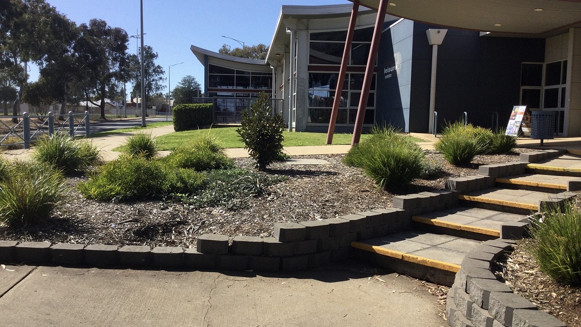 Swan Hill Leisure Centre is a low set grey and blue building that is nestled amongst lush green trees. Access to the centre is via Pritchard Street with parking available in close proximity to the entrance, including a number of accessible car spaces. Swan Hill Leisure Centre is a low set grey and blue building that is nestled amongst lush green trees. Access to the centre is via Pritchard Street with parking available in close proximity to the entrance, including a number of accessible car spaces.