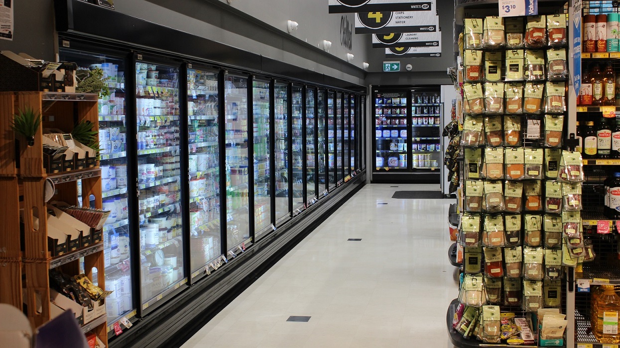 This is the corner section of the grocery store where a variety of chilled products are placed in a walk-in cold storage and chillers. The floor color is white and the walls in this section are painted grey. This is the corner section of the grocery store where a variety of chilled products are placed in a walk-in cold storage and chillers. The floor color is white and the walls in this section are painted grey.