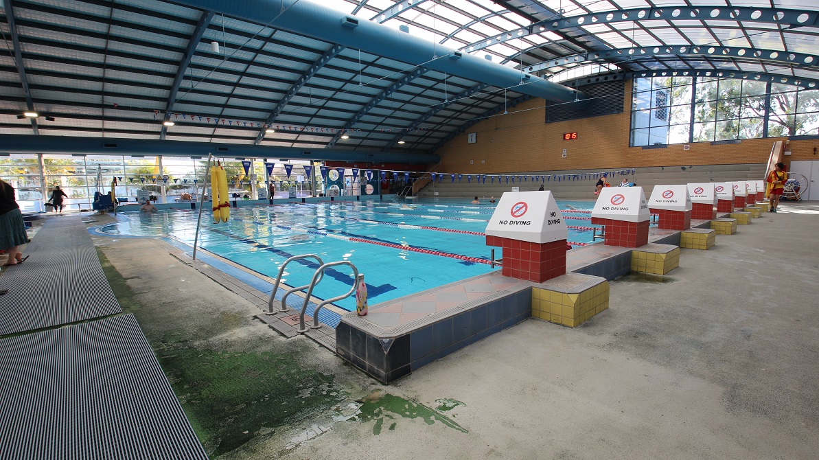 A closer look at the 8-lane 25m lap pool. Near the pool are metal-looking grey mats, which serve as passage when moving around the Aquatic centre. There are also several layers of concrete bench ready that can accommodate more than 50 people. There is a pool ladder adjacent to the elevated section with no-diving signboards. A closer look at the 8-lane 25m lap pool. Near the pool are metal-looking grey mats, which serve as passage when moving around the Aquatic centre. There are also several layers of concrete bench ready that can accommodate more than 50 people. There is a pool ladder adjacent to the elevated section with no-diving signboards.